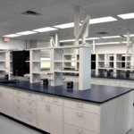 85 - Metal Casework, Workbenches, Fixed Lab Islands, Reagent Shelving, Sinks, Pegboards, Fume Hoods
