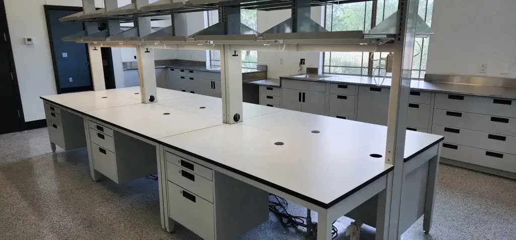 Flexible laboratory systems with shelving and phenolic countertops.