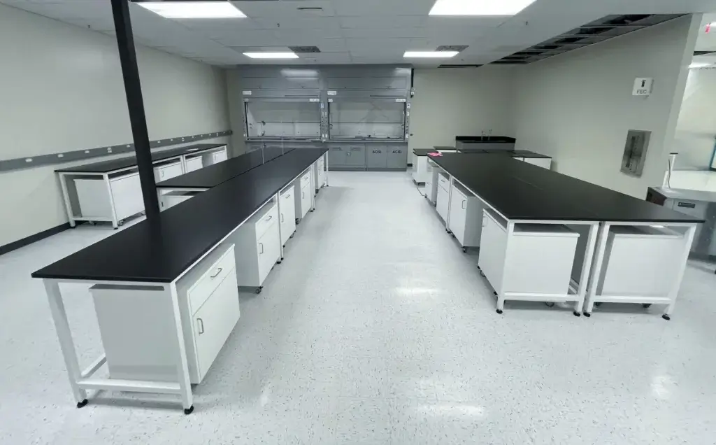 White laboratory tables with black epoxy countertops
