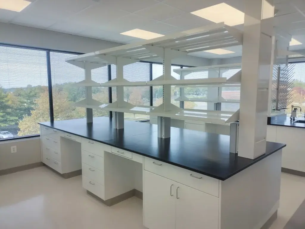 White lab casework with shelves and epoxy counters.