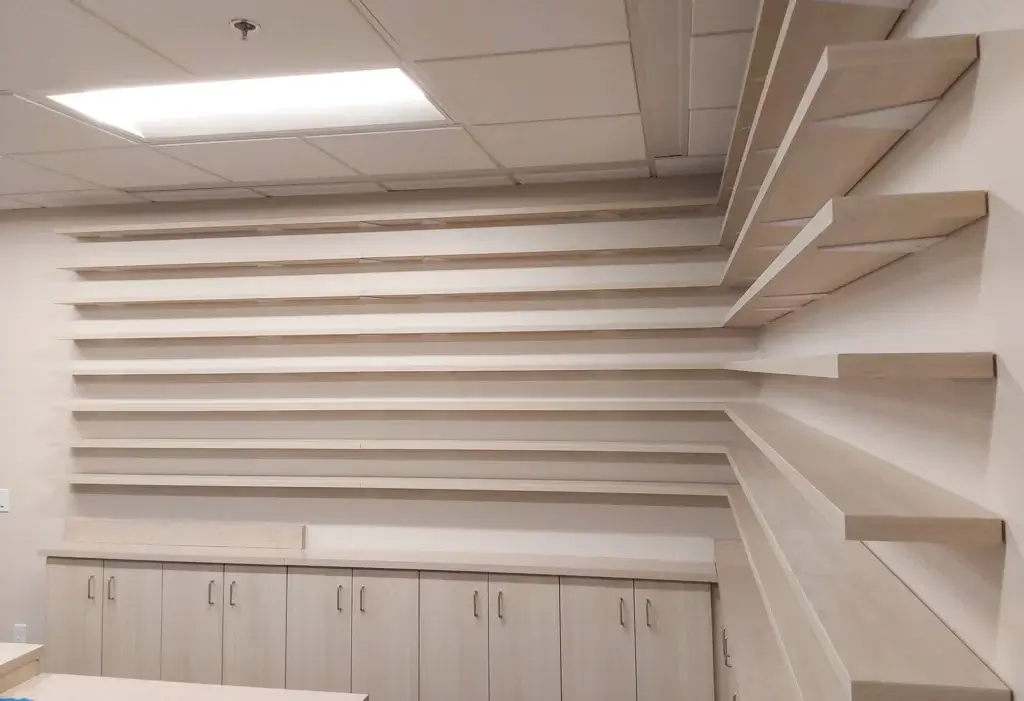 Plastic laminate base cabinets with laminate wall shelving.