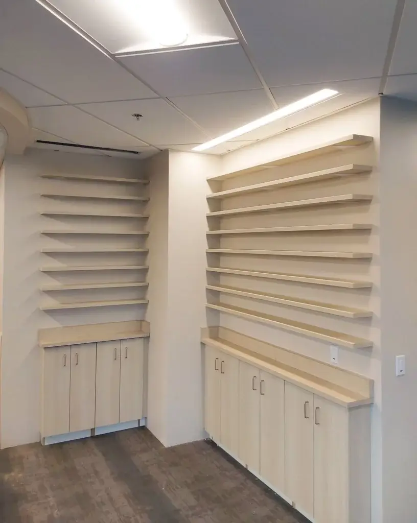 Plastic laminate base cabinets with laminate shelving above.