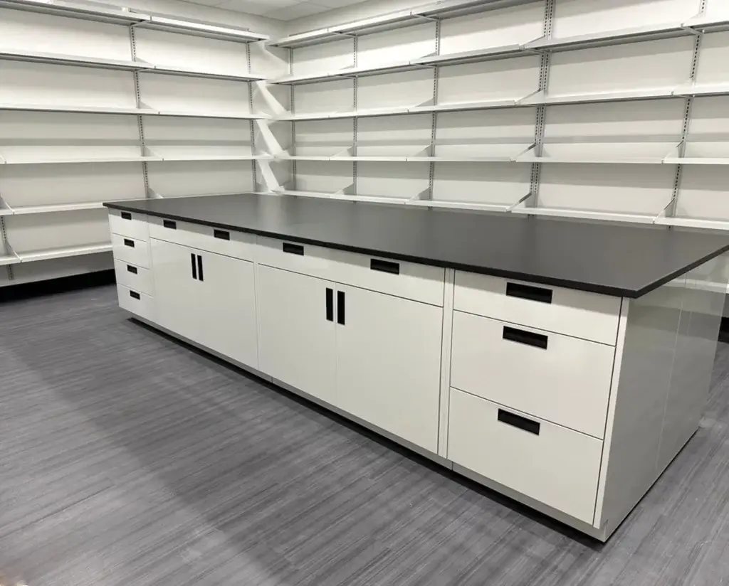 Light Grey Powder Coated Metal Casework with black phenolic countertops and wall shelving.