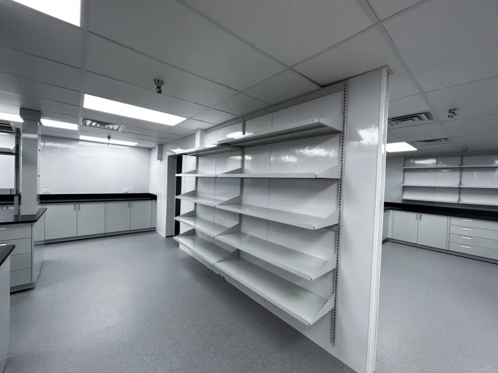 Floor to ceiling wall shelving for a laboratory space.