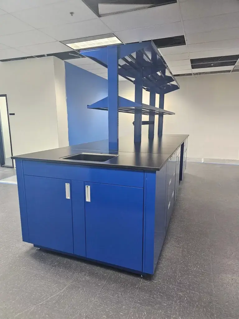 Side profile of blue laboratory island with modular shelving in a lab setting