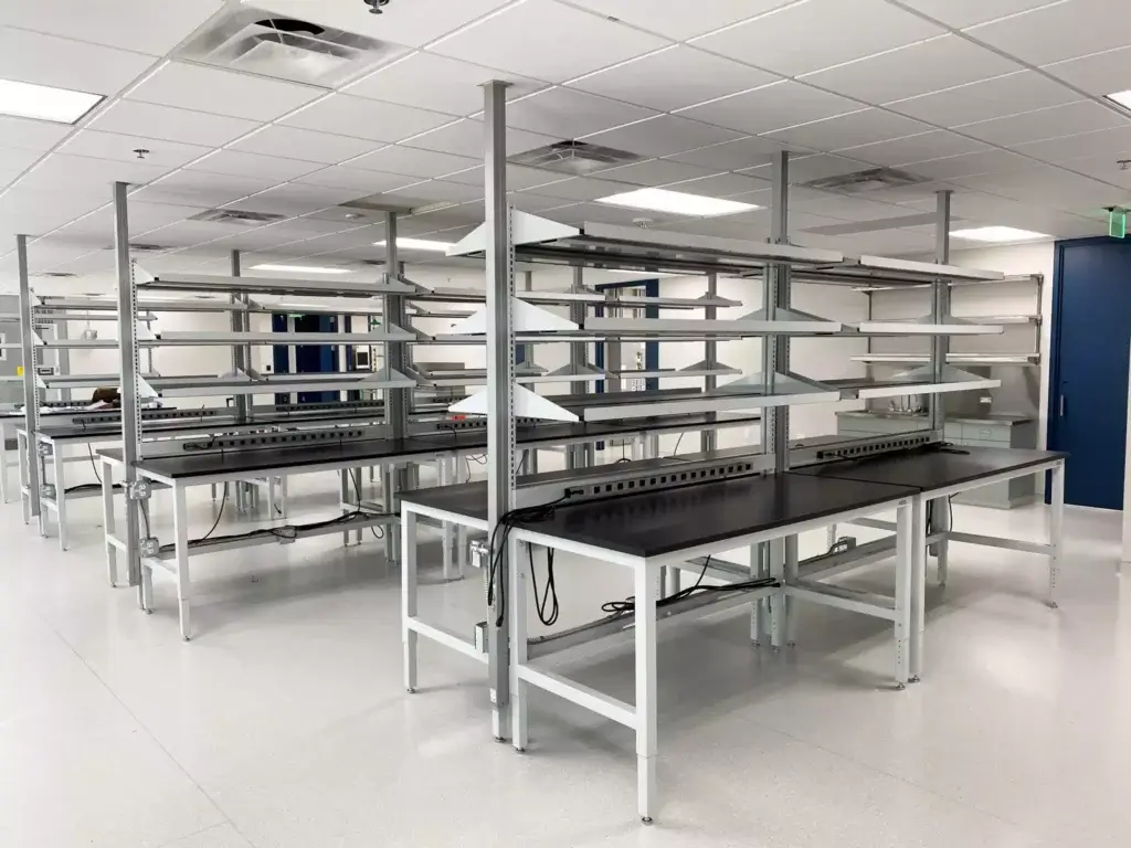 Height Adjustable Lab Tables for Biotechnology Research with Shelving and Power Service Chases | OnePointe Solutions