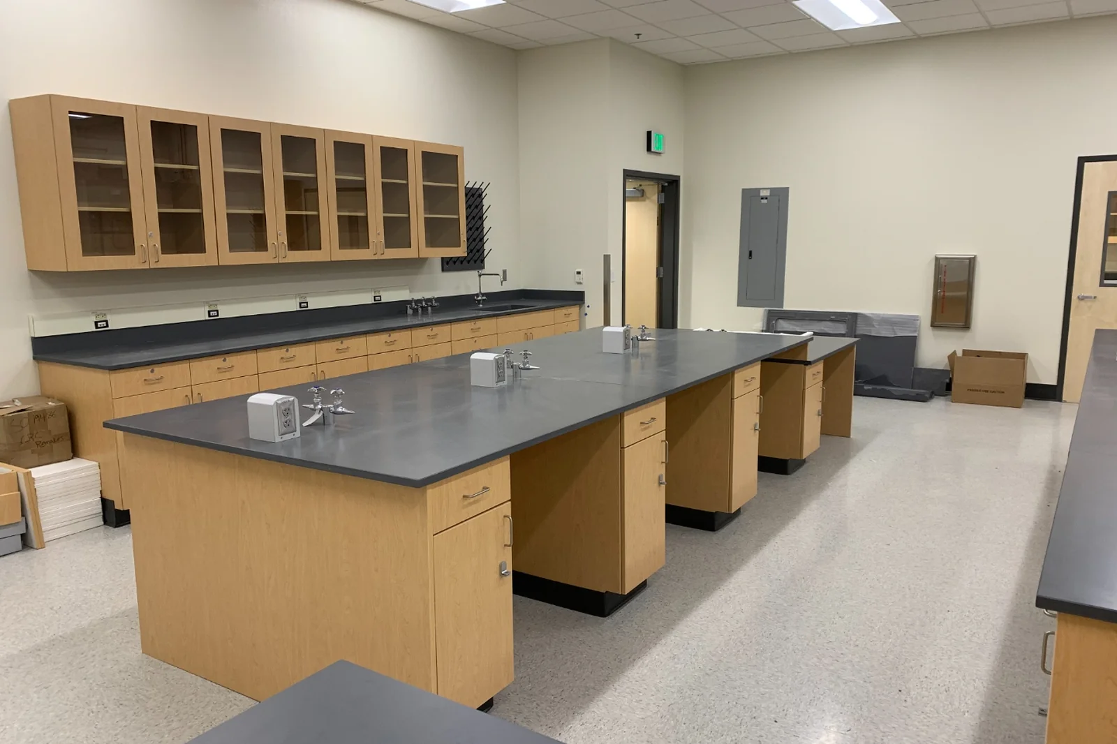Chemistry teaching laboratory with white painted steel casework and bench sinks
