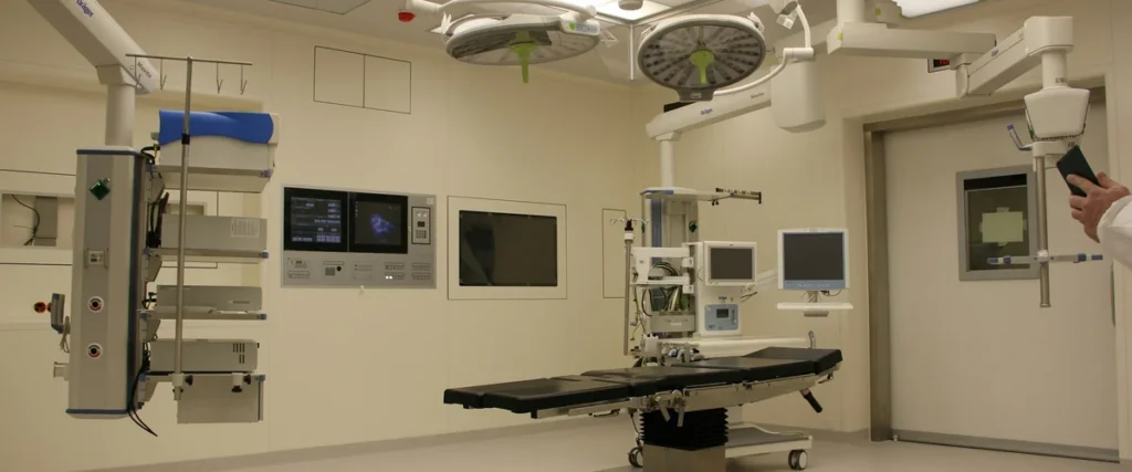 Sterile clinical suite with stainless steel surfaces and ceiling-mounted lighting
